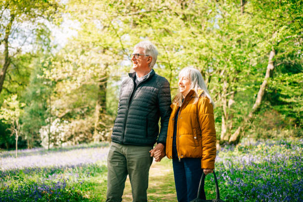 istock Senior couple walking together in nature 1407285361