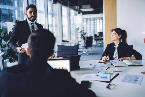 istock Successful business partners sharing ideas during conference in office 1407285362