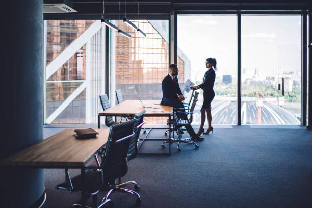 istock Two colleagues discussing business in meeting room 1407285392
