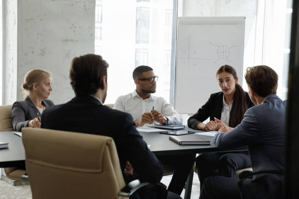 istock Multiethnic young and middle-aged businesspeople engaged in group meeting 1407285659
