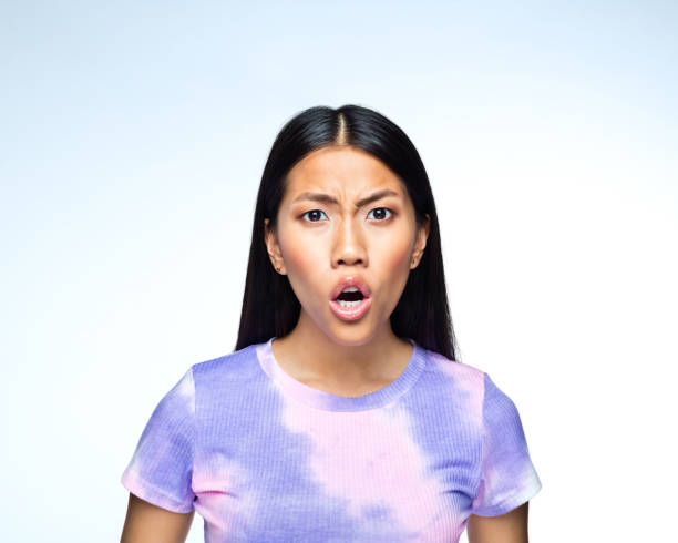 istock Shocked young woman 1407288636