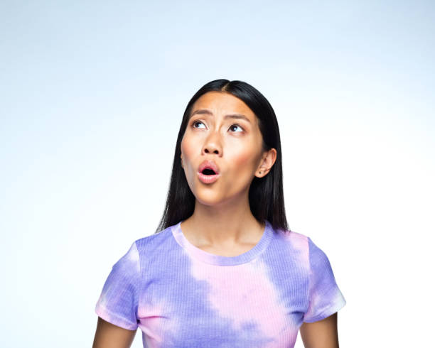 istock Surprised young woman 1407289106