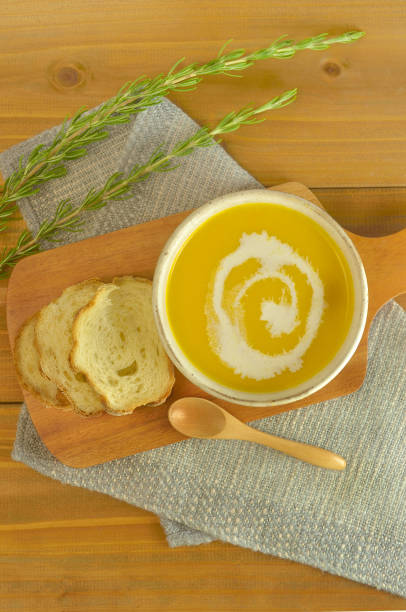 istock Pumpkin Soup & Pieces of Bread on the Table 1407291781