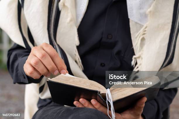 Closeup Of Jewish Man Wearing Tallit Reading The Siddur On Shabbat Stock Photo - Download Image Now