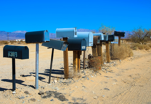 Many mailboxes on the roadside of the country road. California, United States