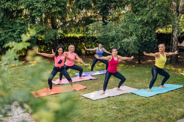 istock A group of sportswomen doing tai chi exercise in the back yard 1407293758