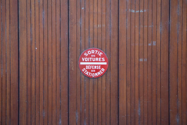 Sign in French translated as 'car exit, no parking'