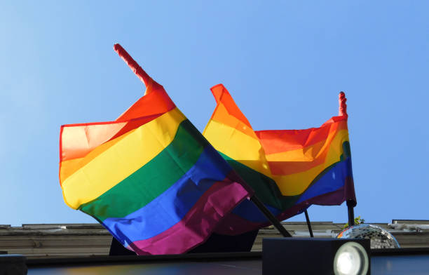 istock Pride rainbow lgbt gay flag being waved on sky background 1407302342