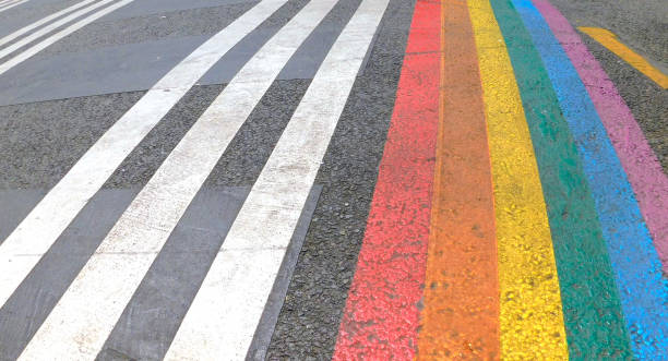 istock Marked crosswalk with lbgtq pride flag rainbow stripes 1407302351