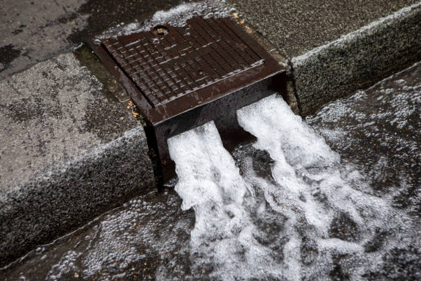 Paris streets are cleaned by water from a curb-side opening which washes debris into the sewer system