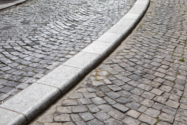 istock Cobbled street and curb in Paris 1407302619