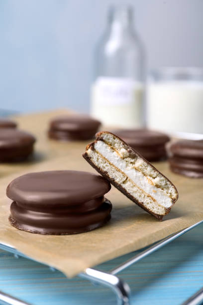 istock Tasty choco pies on parchment paper, closeup view 1407303156