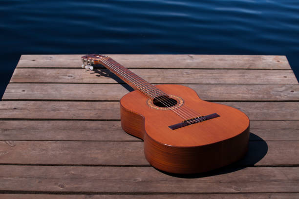 istock guitar on wooden boards on the bridge 1407303388