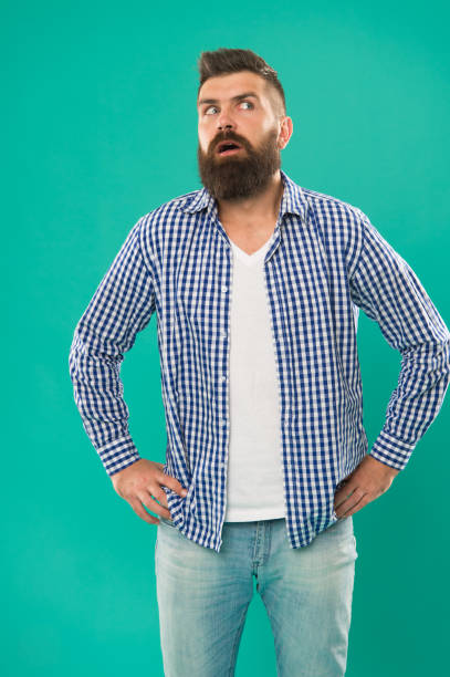 istock Holy wow. Surprised hipster blue background. Hipster keep mouth open with surprise. Hipster in casual style. Bearded man wear hipster beard. Barbershop. Mens hair salon. Fashion and style 1407303413
