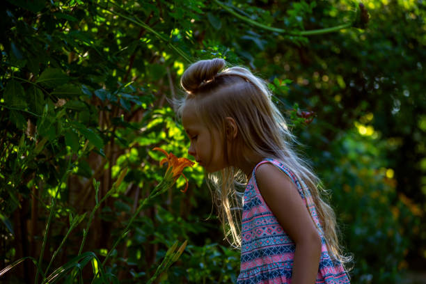 istock little girl in a summer park 1407308920