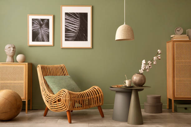 istock Stylish living room interior design with armchair, modern commode, mock up frames and creative home accessories. Template. Copy space. 1407309513