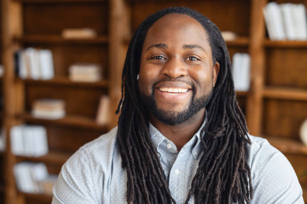 Smiling young African American with dreadlocks