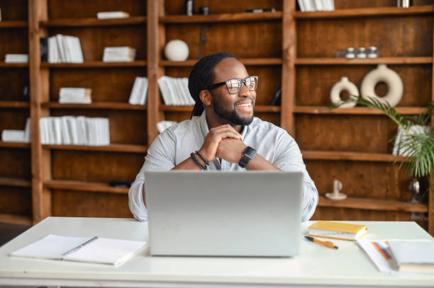 istock Happy thoughtful young African American man 1407309660