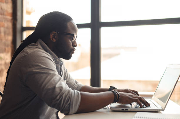 istock African-American male author typing on a laptop 1407309666