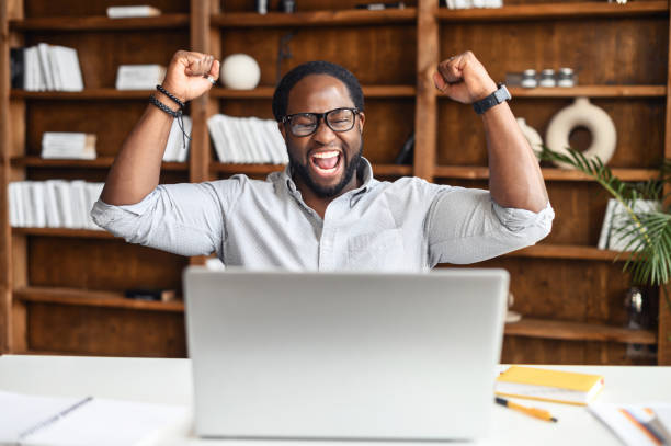 istock Lucky African American student raised fists up 1407309672