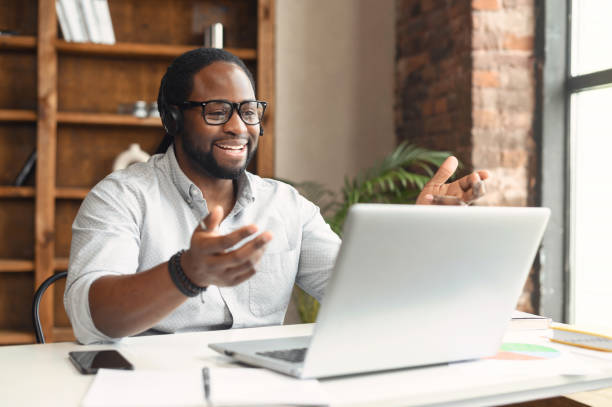 istock Happy hispanic businessman at online video conference 1407309716