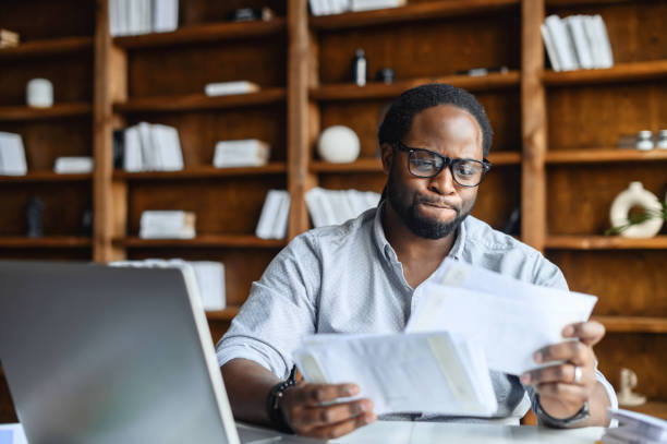 istock Confused smart young African-American entrepreneur 1407309744