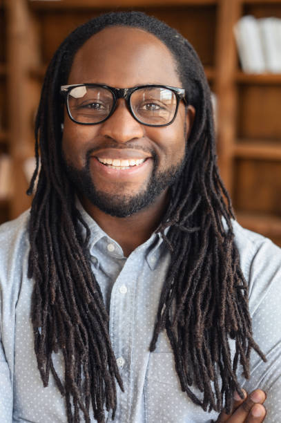 istock Smiling young African American with dreadlocks 1407309792