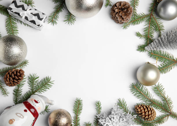 istock Christmas greeting card with space for text. Flat lay composition of fir tree branches and festive decor on white background 1407310971