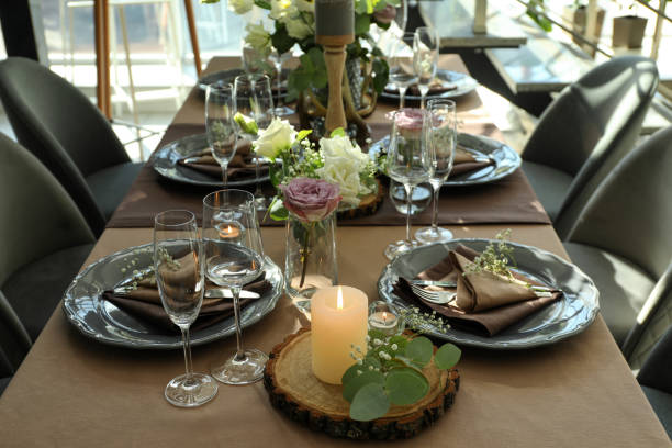 istock Festive table setting with beautiful tableware and floral decor in restaurant 1407310973