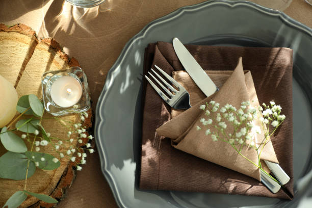 istock Festive table setting with beautiful tableware, candle and floral decor, flat lay 1407311311