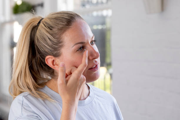 istock Placing Contact Lens in Eye 1407311464