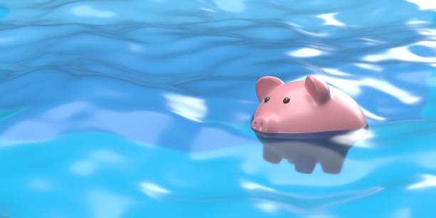istock Piggy bank sinking in water background, copy space 1407314493