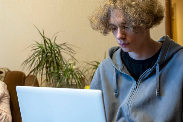 istock A young guy is being trained through a laptop. Remote communication 1407315722