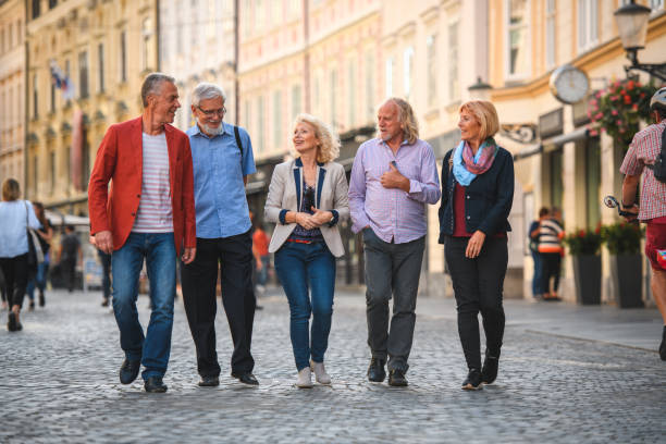 istock Cheerful Active Senior Friends Going For A Stroll In The City 1407315849
