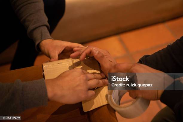 House Moving Process Owner And Moving Staff Packing Protecting And Transporting Furniture And Movables To Moving Truck Stock Photo - Download Image Now