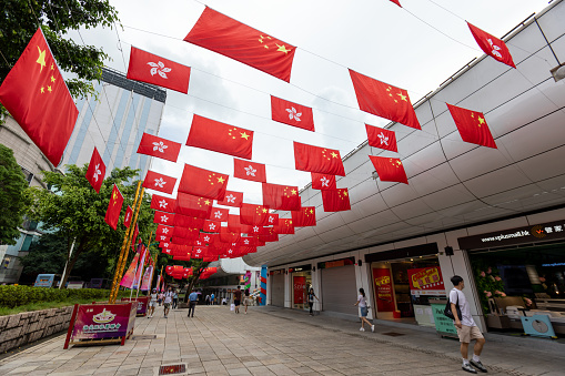 Hong Kong - July 7, 2022 : Park Lane Shopper's Boulevard is decorated with flags of Hong Kong and China to celebrate the 25th anniversary of Hong Kong's handover from Britain to China.