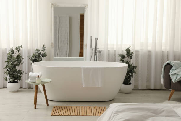 istock White tub and decor in light room. Interior design 1407320361