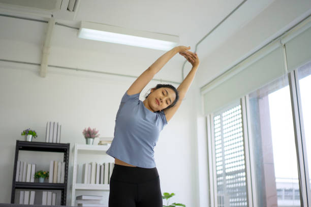 istock Woman is exercising at home. 1407323004