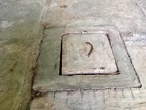 sewer cover tool made of cement that is cast in the form of a box