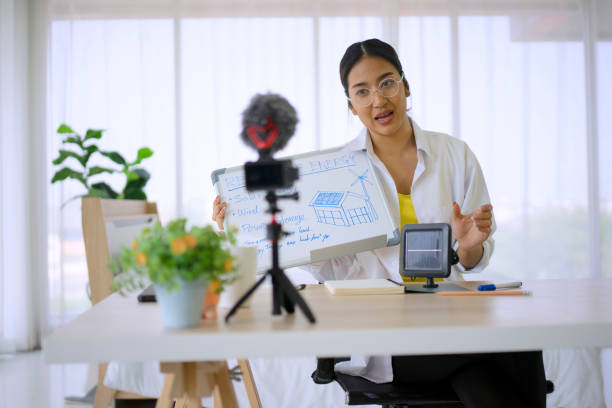 istock Young woman is working and make origami with video conference. 1407325007