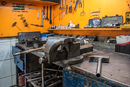 A large vise on the workbench