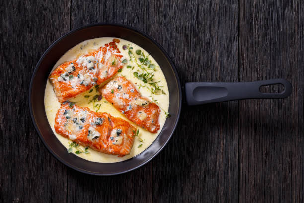 istock salmon fillet with creamy blue mold cheese sauce 1407328286