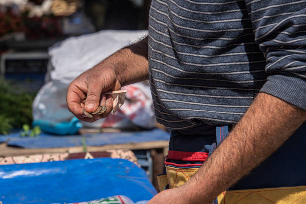 istock Greengrocer holding a coin 1407330668