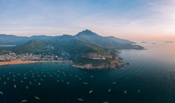 Drone view of Bai Ran mountain pass in sunrise by Xuan Hai beach, Song Cau town, Phu Yen province, central Vietnam