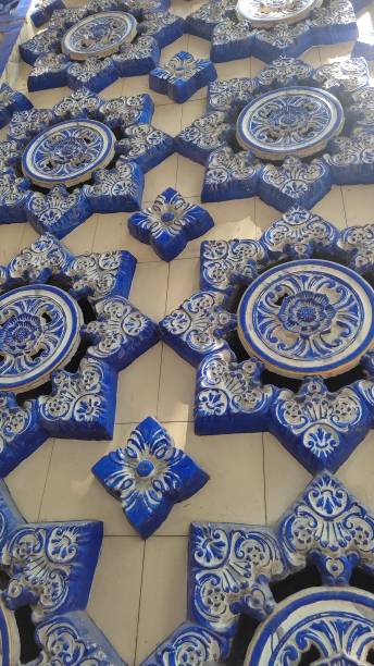 istock Blue flower ornaments on the wall 1407331123