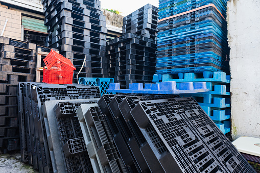 Plastic shelves stacked together on a construction site