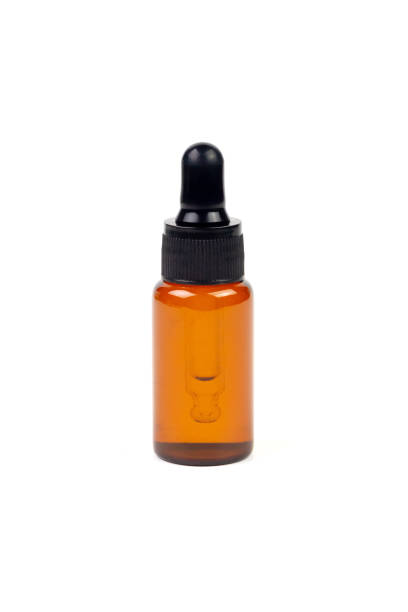 istock Essential oil in amber bottle. 1407332020