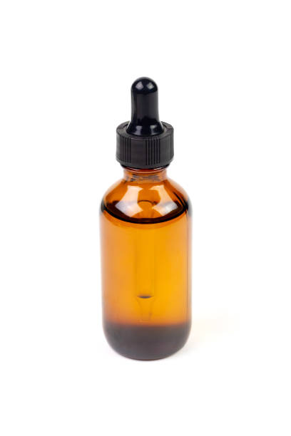 istock Essential oil in amber bottle. 1407332021