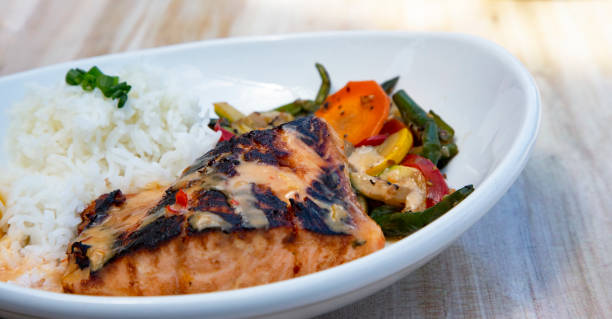 istock Delicious miso marinated salmon with rice and vegetables 1407333477