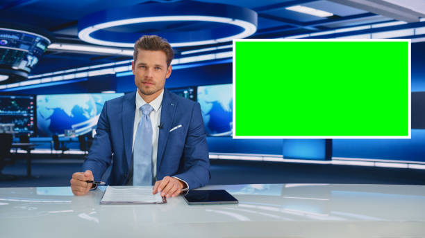 istock TV Talk Show Live News Program: Anchorman Presenter Reporting, Uses Green Screen Template. Television Cable Channel Anchorman Host Talks. Network Broadcast Newsroom Studio Mockup. 1407333774